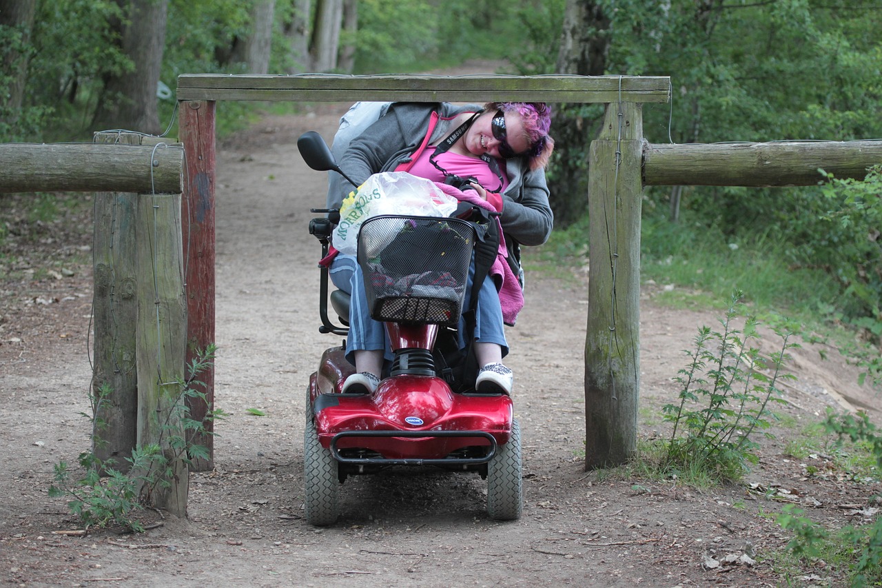 Woman needing to duck under a low park entry barrier